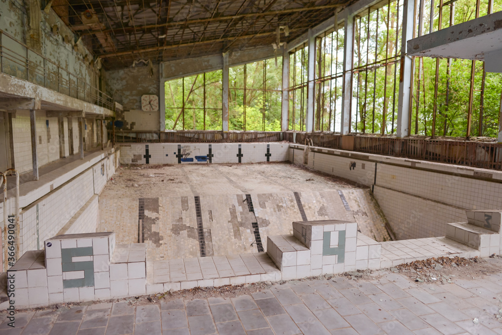empty and destroyed olympic pool in ancient village shaken by Chernobyl explosion