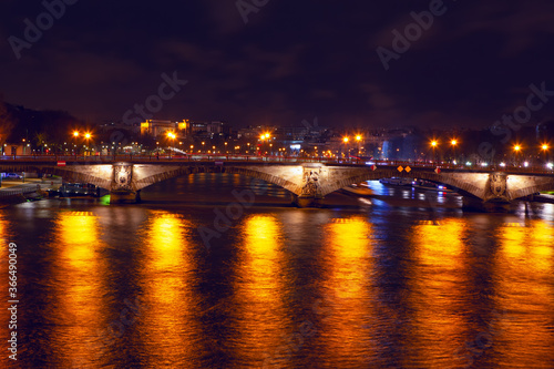 Pont des Invalides In the night illumination . Night view of Seine river and bridge in Paris 