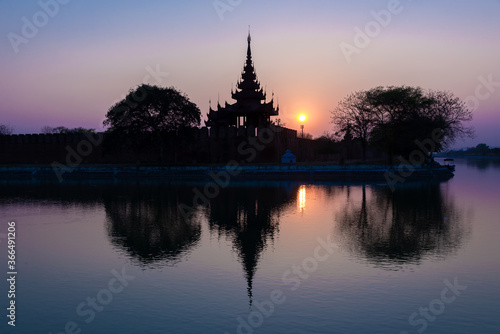 Royal palace at sunset with water reflections in Mandalay Burma, Myanmar © Delphotostock