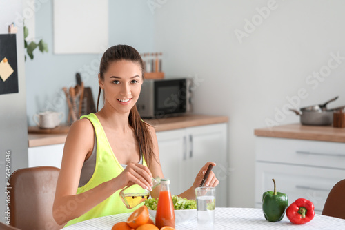 Beautiful young woman makin...