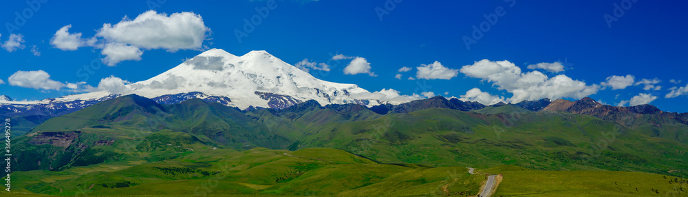 Panorama Road Leading to Mount Elbrus with Green Meadows at Summer. North Caucasus, Russia