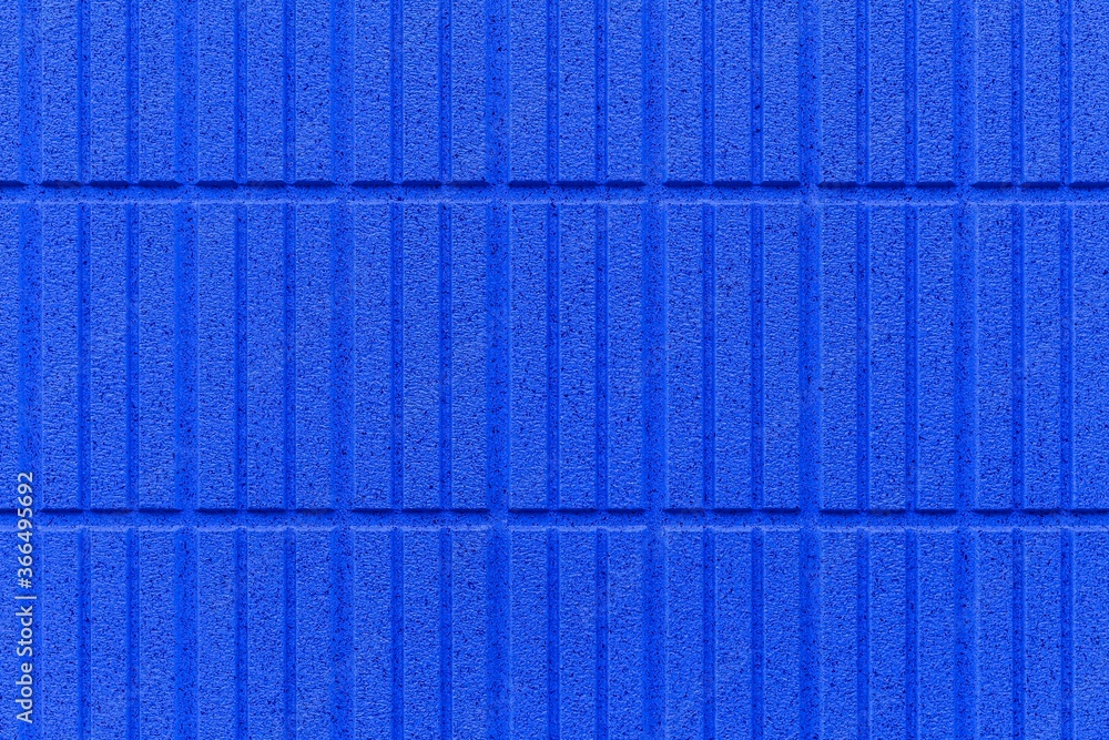 Fototapeta premium Modern blue stone wall with stripes texture and seamless background