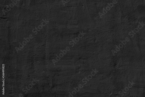 Black stucco texture. Designer interior background. Abstract architectural surface.