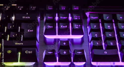 Computer keyboard with coloured letter keys