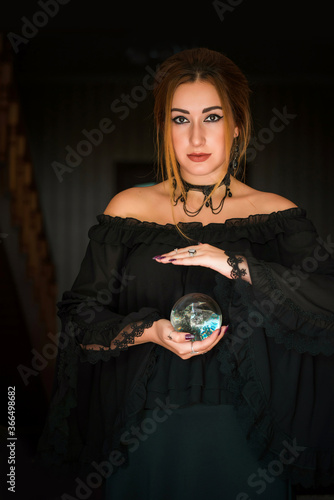 Woman fortune teller on a crystal ball, Concept of predictions, magic rituals and wicca photo