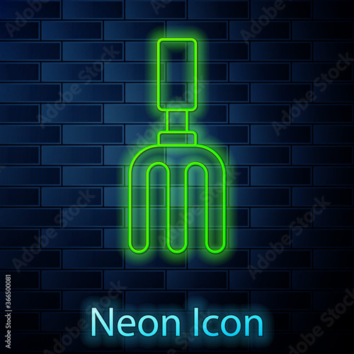 Glowing neon line Garden rake icon isolated on brick wall background. Tool for horticulture, agriculture, farming. Ground cultivator. Vector.