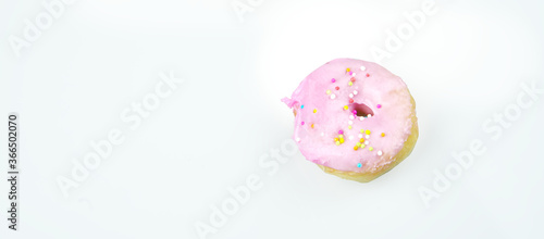 Donut mini with colorful sprinkles isolated on white background. Top view.