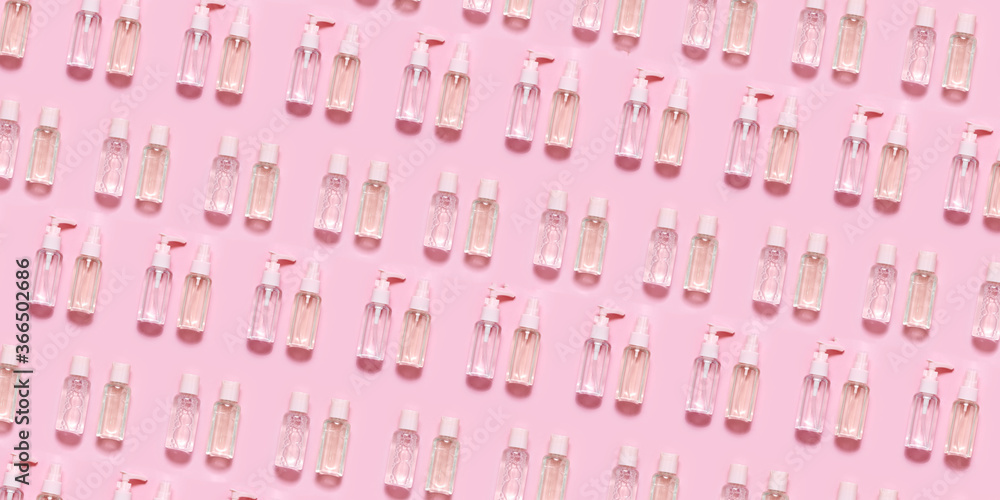 Skin care open composition pattern. Hilauronic acid, lotion, serum and gel on abstract pink background. Skin care open composition pattern. Hilauronic acid, lotion, serum and gel on abstract pink background.