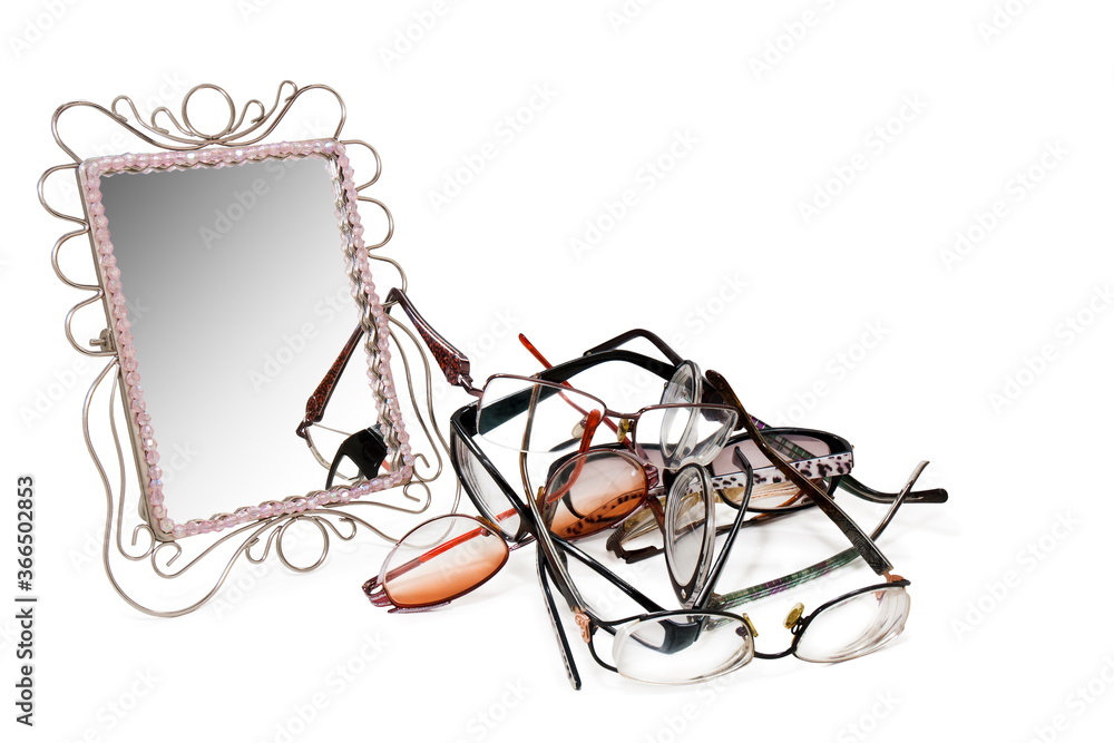 table mirror and eyeglasses