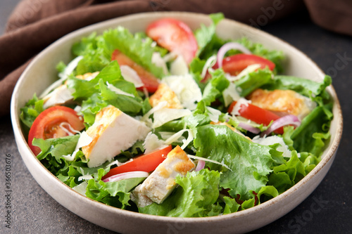 Chicken salad with tomatoes and parmesan cheese