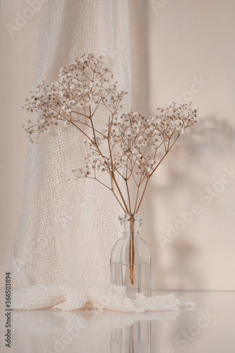 Flowers a glass vase with a decorative pink background