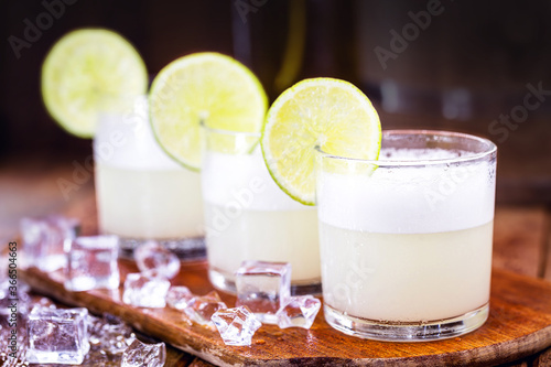 Pisco sour, a cocktail prepared with pisco and lemon, sweetened, with brandy, eggs, served cold. Original drink from turkey, south america. photo