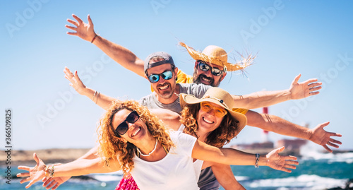 Slika na platnu Group of happy people enjoy travel and summer holiday vacation together having f