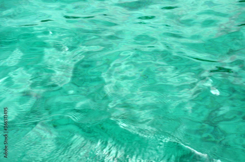 beautiful turquoise blue ocean water background with a ripples