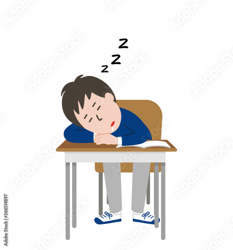 教室で居眠りをする男子学生