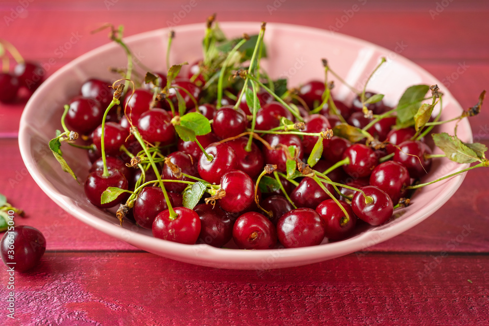 Close up of a plate with red and juicy cherries Close up of a plate with red and juicy cherries