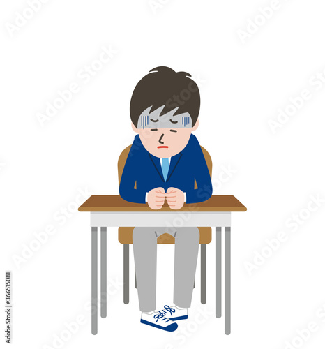 席に座りうつむいている顔色の悪い男子学生