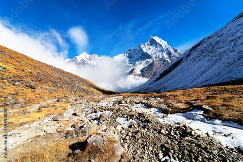 Panorama of Mount Machapuchare (Fishtail) at sunset, view from Annapurna base camp in the Nepal Himalaya. Machhapuchchare is a mountain in the Annapurna Himal of north Central Nepal photo