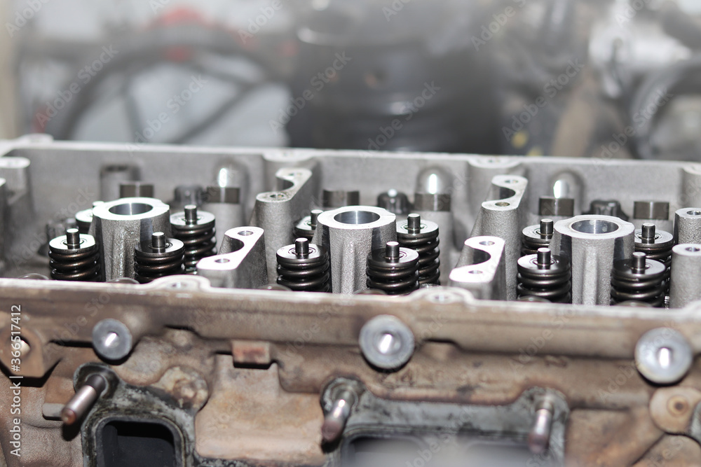 The mechanic is checking the engine. The mechanic is checking the engine.
