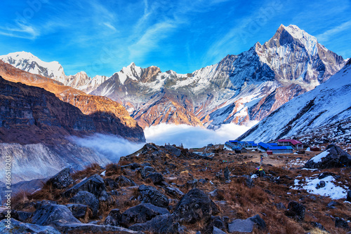 Panorama of Mount Machapuchare (Fishtail) at sunset, view from Annapurna base camp in the Nepal Himalaya. Machhapuchchare is a mountain in the Annapurna Himal of north Central Nepal photo