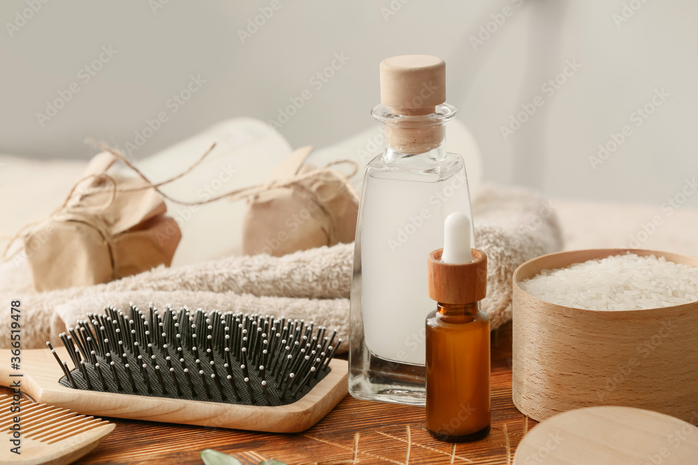Healthy rice water with cosmetic supplies on table Healthy rice water with cosmetic supplies on table