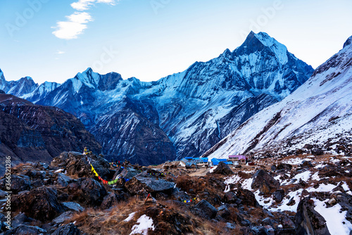 Panorama of Mount Machapuchare (Fishtail) at sunset, view from Annapurna base camp in the Nepal Himalaya. Machhapuchchare is a mountain in the Annapurna Himal of north Central Nepal photo