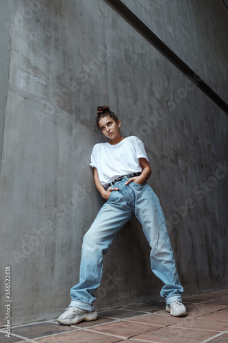 Retro Chic: Stylish Young Woman in 80's 90's Inspired Outfit © EVISUAL