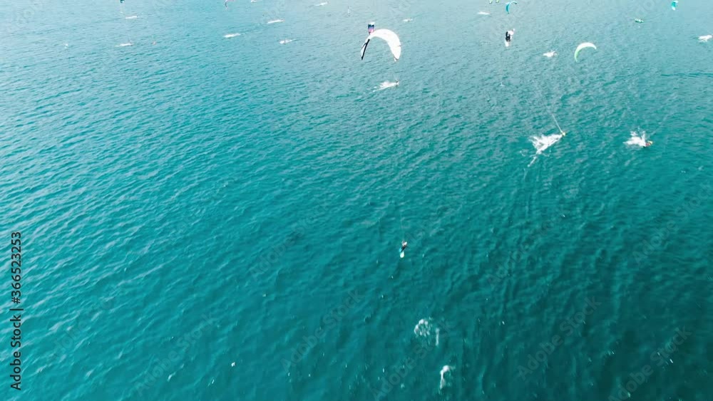 Kitesurfer stunt from above, lake garda Kitesurfer stunt from above, lake garda