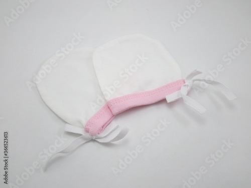 White fabric mitten for newborn baby