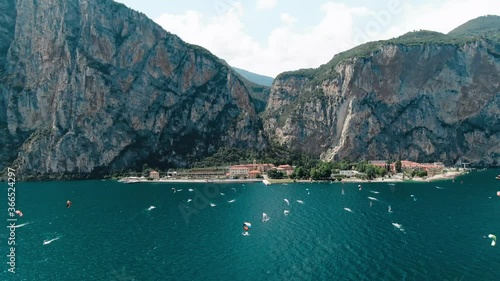 Kitesurfer in front of mountains, lake garda
