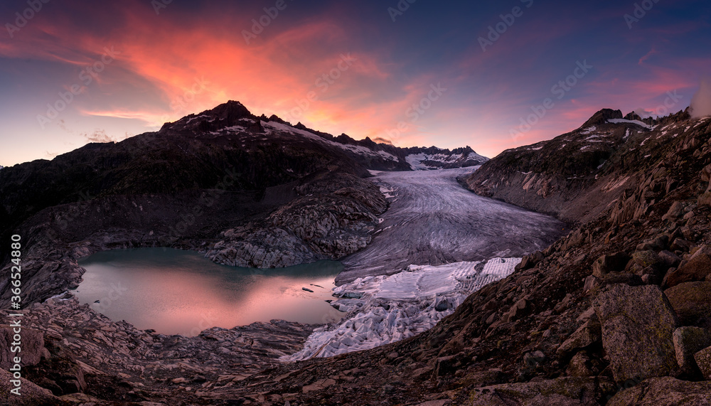 dramatic colored clouds at sunset over Rhoneglacier