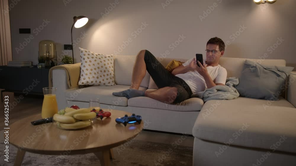 Slomo: Excited Handsome Caucasian Man Using His Smartphone Scrolling Social Media Medium Shot High Quality 4k Footage Slomo: Excited Handsome Caucasian Man Using His Smartphone Scrolling Social Media Medium Shot High Quality 4k Footage