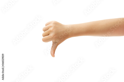 Thumb down. Children's hand, palm gesturing isolated on white studio background with copyspace for your advertising. Little girl's hand with signs. Childhood, education, sales, ad, expression concept.