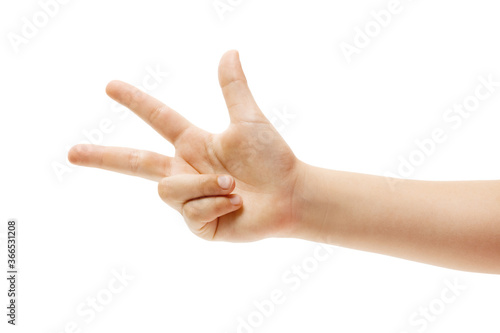 Three. Children's hand, palm gesturing isolated on white studio background with copyspace for your advertising. Little girl's hand with signs. Childhood, education, sales, ad, expression concept.