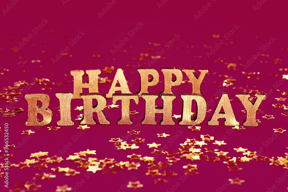 Fototapeta premium Text Happy birthday laid out of gold letters on beautiful background. Golden stars confetti.