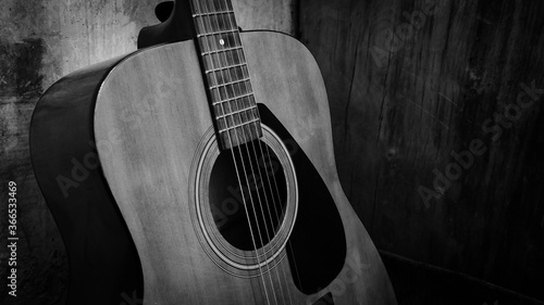 Acoustic guitar, black and white photo, musical instrument and strings.