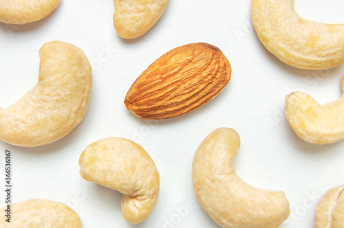 Creative food layout. Cashew on white background top view copy space. Concept of food, healthy nutrition, nut, healthy fats. Flat lay. Cashew pattern. Organic healthy vegan snack macro shot
