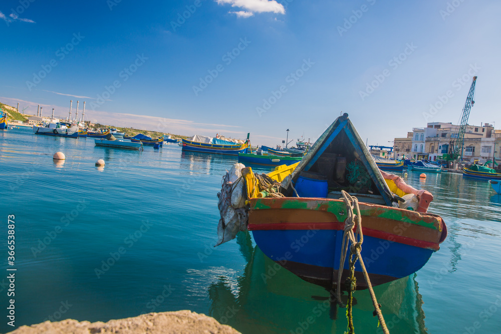 Il-Luzzu, the national boat of Malta, in the harbour of Marsaxlokk