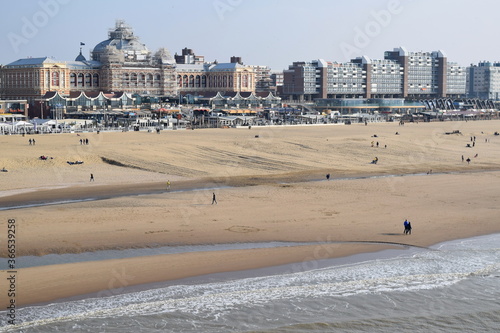 Long wide sandy beach of the sea resort in the Netherlands Scheveningen, North Sea coast, The Hague. A place for walks, sea sports such as windsurfing and kitesurfing
