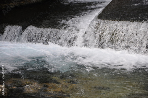 Small waterfall coming down on the rocks