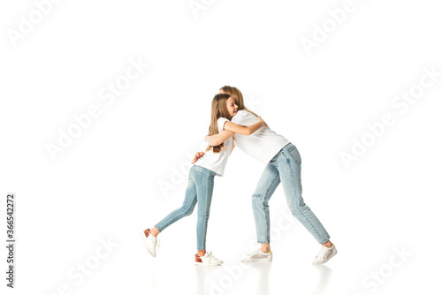 happy daughter hugging mother isolated on white