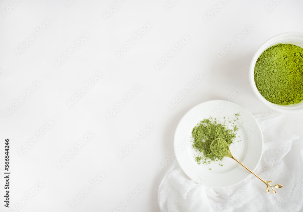 Green Tea Powder Flatlay on White Background. Matcha Powder with Copy Space Green Tea Powder Flatlay on White Background. Matcha Powder with Copy Space