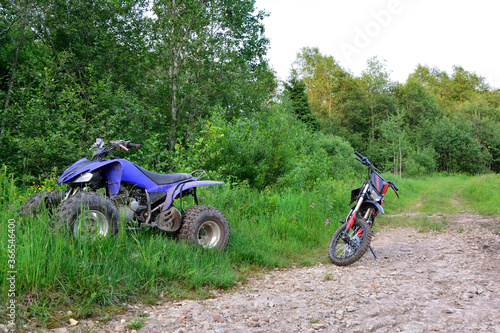 ATV in the forest stands cooling down