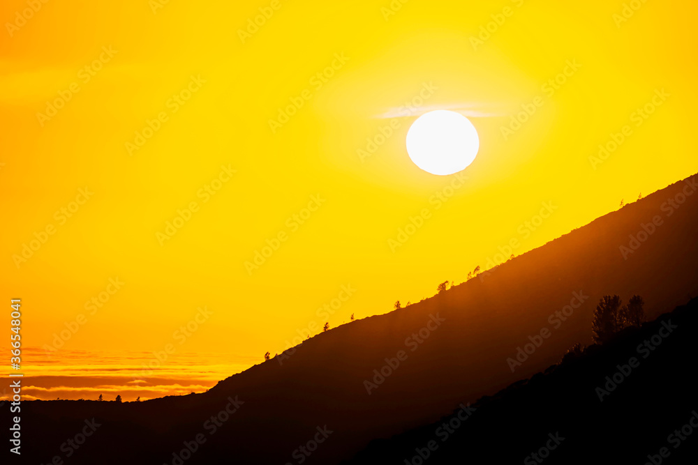 Sunrise, Sunset over Mountain silhouette 
