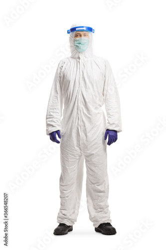 Man in a hazmat suit gesturing stop with hand isolated on white background © Ljupco Smokovski