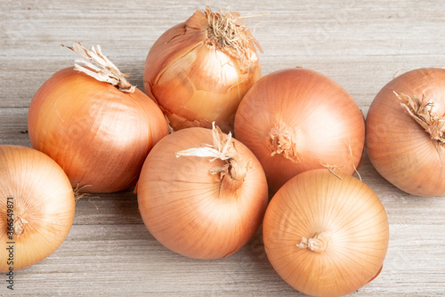 Sweet Southern-Grown Onions On A White Panel Board photo