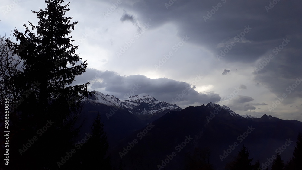 Obraz premium Nature and clouds and trees. silhouette of mountains