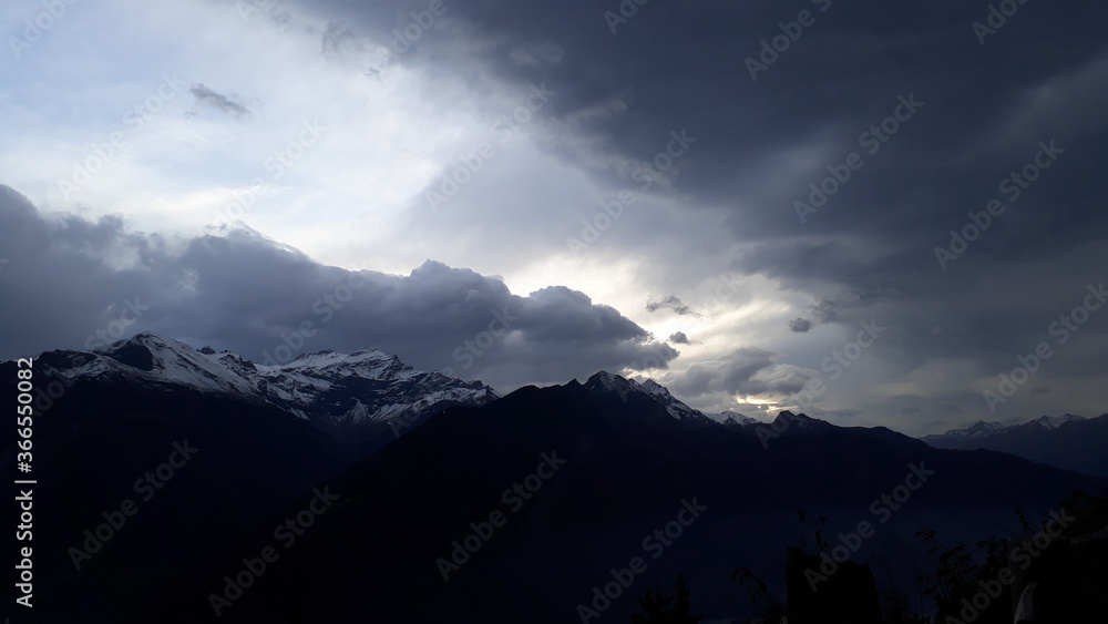 Nature and clouds and trees. silhouette of mountains