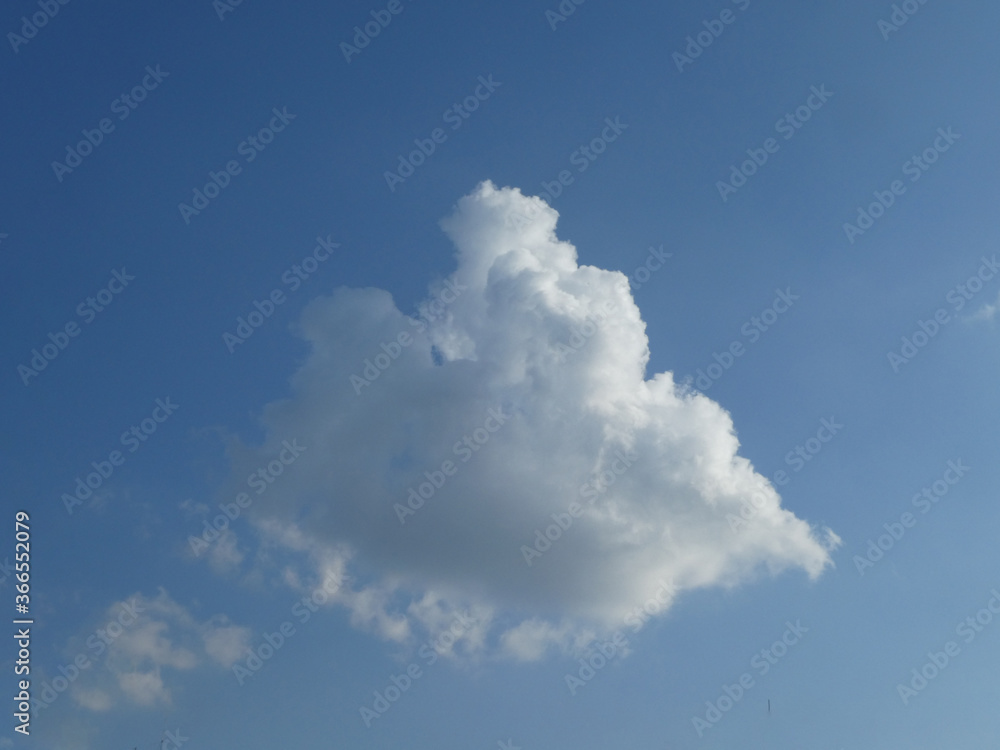 The blue sky with white clouds background and texture The blue sky with white clouds background and texture