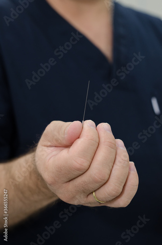 hand with needle